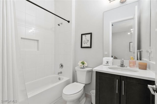 full bathroom featuring vanity, shower / bath combo, and toilet