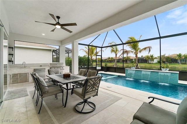 view of pool featuring a patio, glass enclosure, a grill, area for grilling, and pool water feature