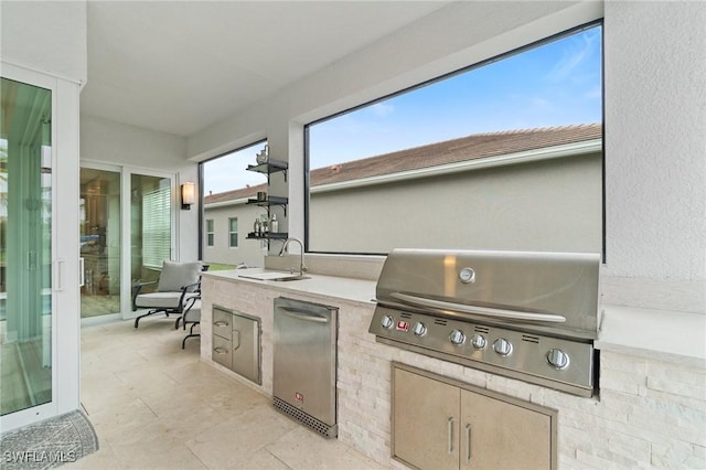 view of patio / terrace featuring area for grilling, exterior kitchen, and sink