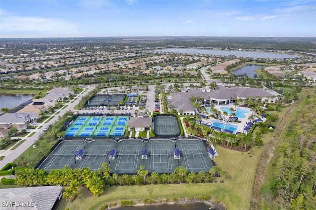 drone / aerial view with a water view and a residential view