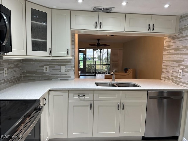 kitchen featuring white cabinetry, range with electric stovetop, decorative backsplash, dishwasher, and sink