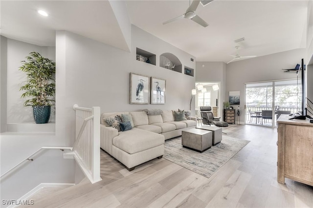 living room with ceiling fan and light hardwood / wood-style floors