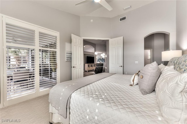 bedroom with ceiling fan and light carpet