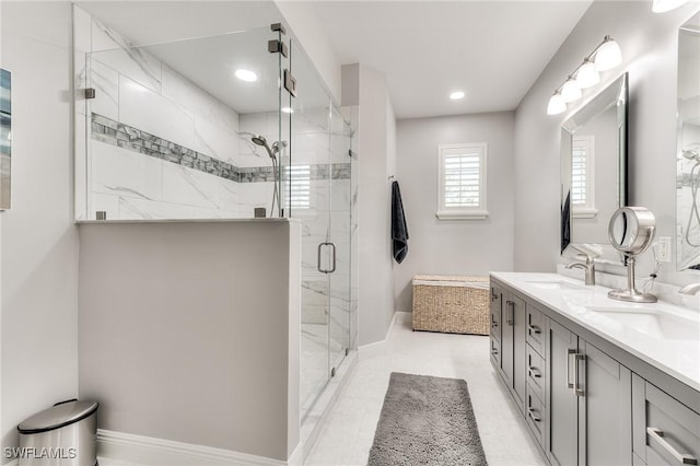 bathroom featuring vanity and an enclosed shower