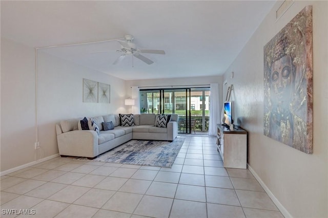 unfurnished living room with ceiling fan and light tile patterned floors