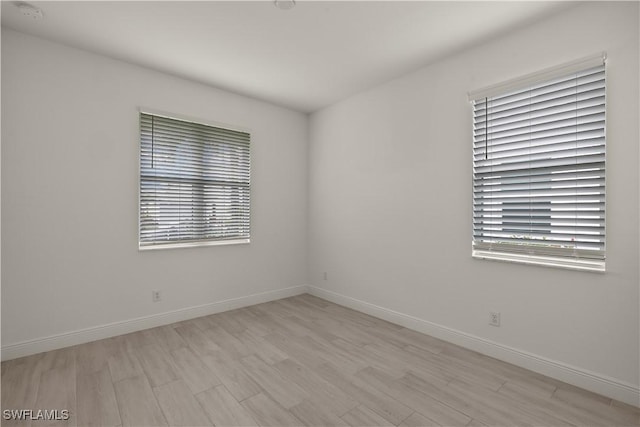 unfurnished room featuring light hardwood / wood-style flooring