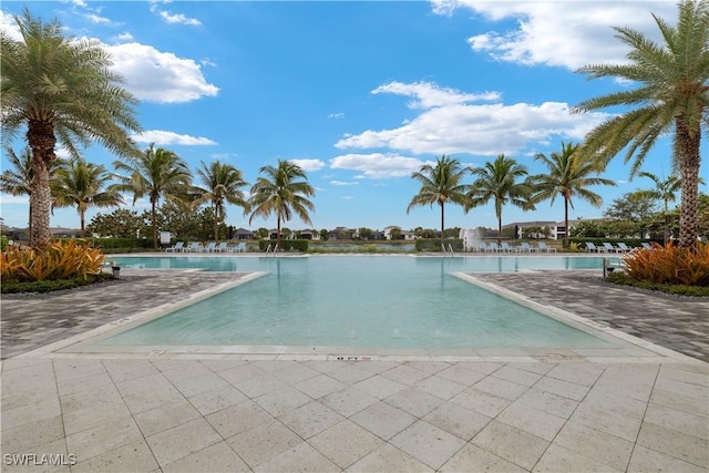 view of pool with a water view