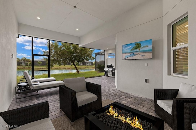 view of patio / terrace featuring an outdoor living space with a fire pit