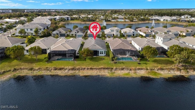 birds eye view of property featuring a water view