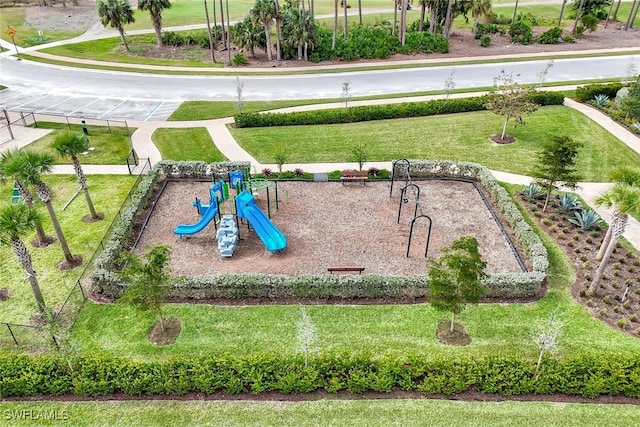 view of jungle gym featuring a lawn