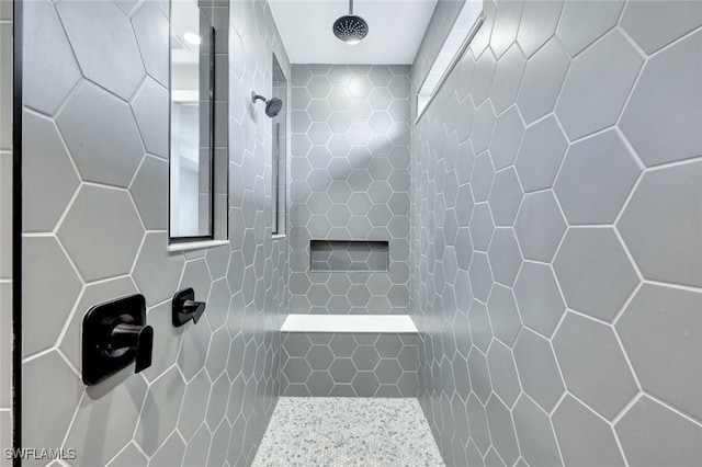 bathroom with tiled shower