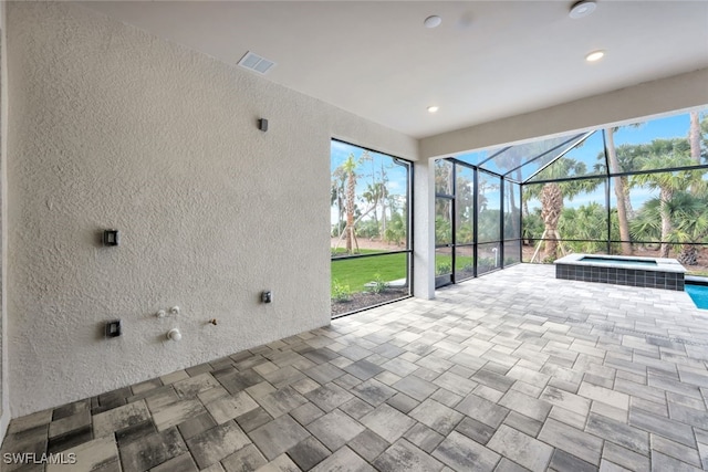 unfurnished sunroom featuring a wealth of natural light