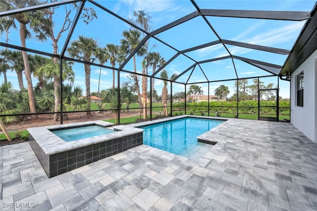 view of swimming pool featuring a lanai, an in ground hot tub, and a patio