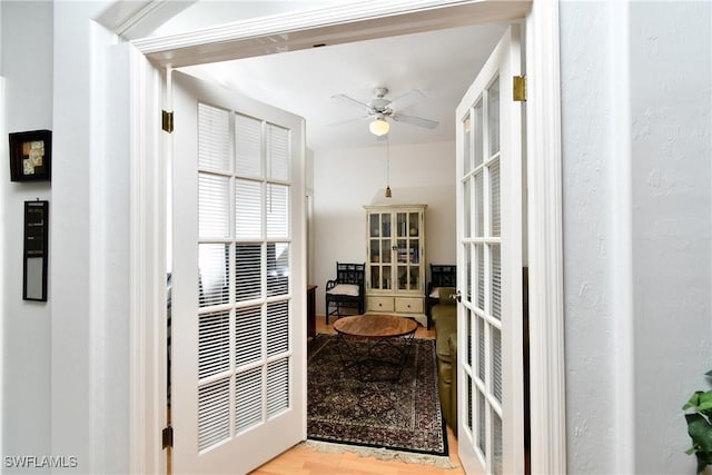 interior space featuring a ceiling fan and french doors