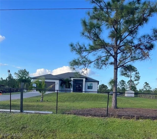 ranch-style house with a front lawn and a garage