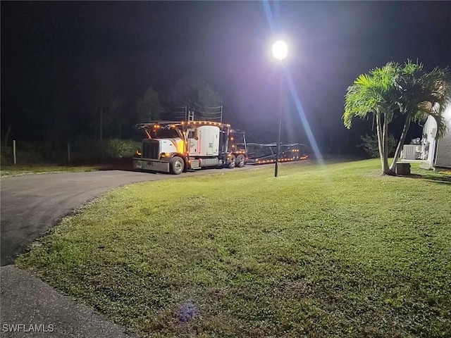 view of home's community featuring a lawn