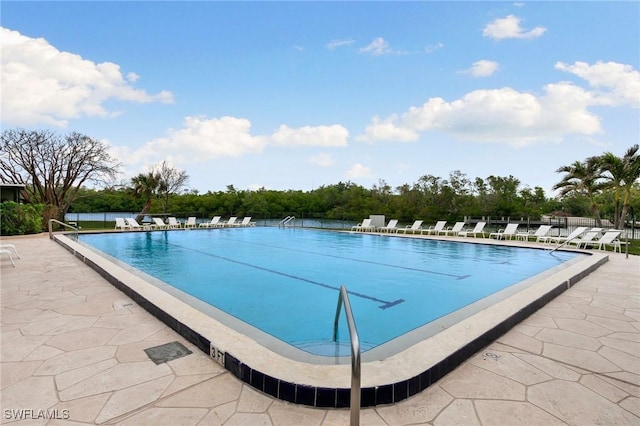 view of swimming pool featuring a patio