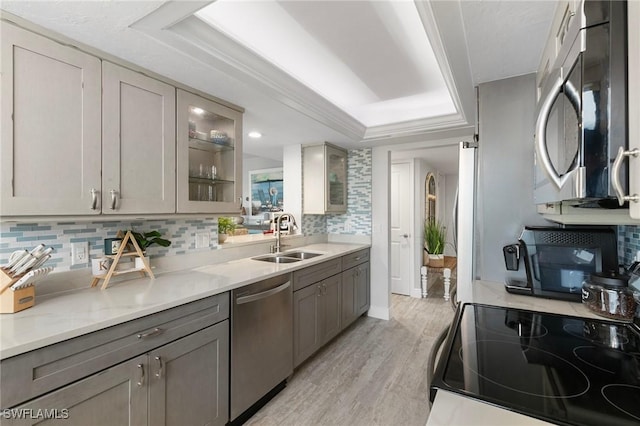 kitchen featuring sink, gray cabinets, and stainless steel appliances