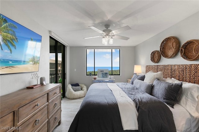 bedroom featuring ceiling fan and light hardwood / wood-style floors