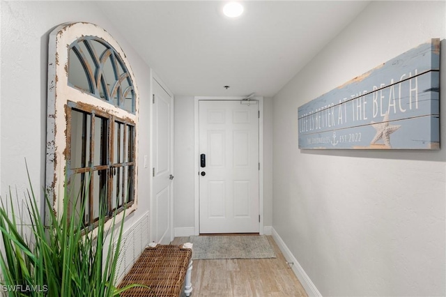 doorway featuring hardwood / wood-style floors