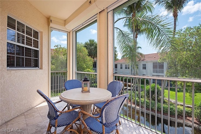 sunroom / solarium featuring healthy amount of natural light
