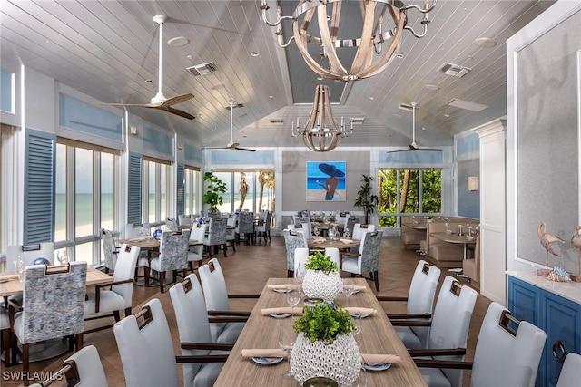 400 L Ambiance Cir Unit 204, Naples, FL 34108 - dining room with lofted ceiling, a ceiling fan, healthy amount of natural light, wood ceiling, and a chandelier