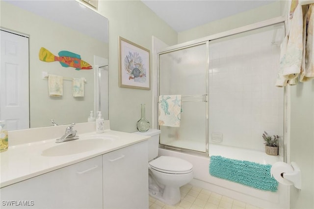 full bathroom featuring vanity, toilet, and combined bath / shower with glass door