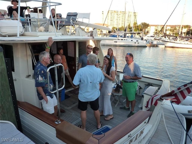 exterior space with a water view and a boat dock