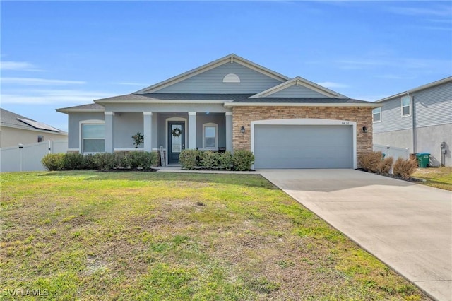 view of front of house featuring a garage and a front yard