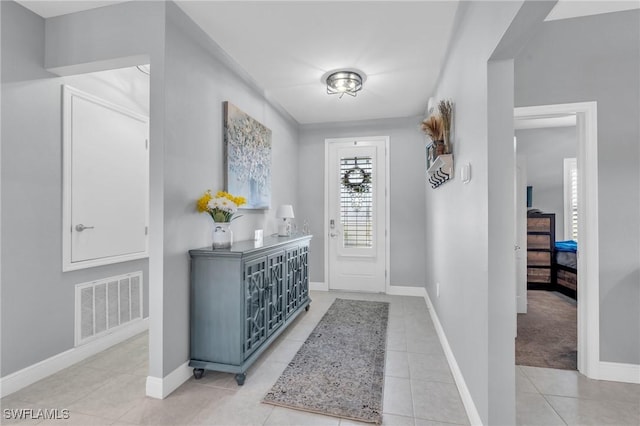 view of carpeted entrance foyer