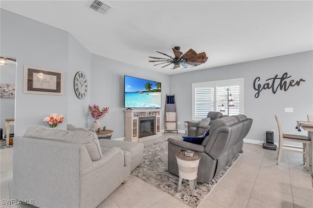 living room featuring ceiling fan and light tile patterned flooring