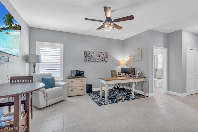 office area with ceiling fan and light tile patterned floors