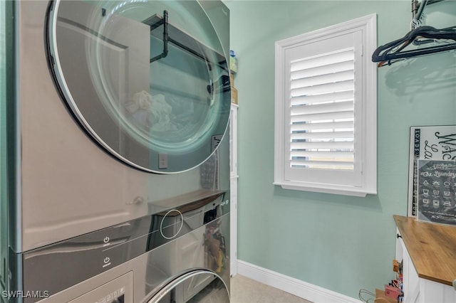 laundry area with stacked washer / dryer