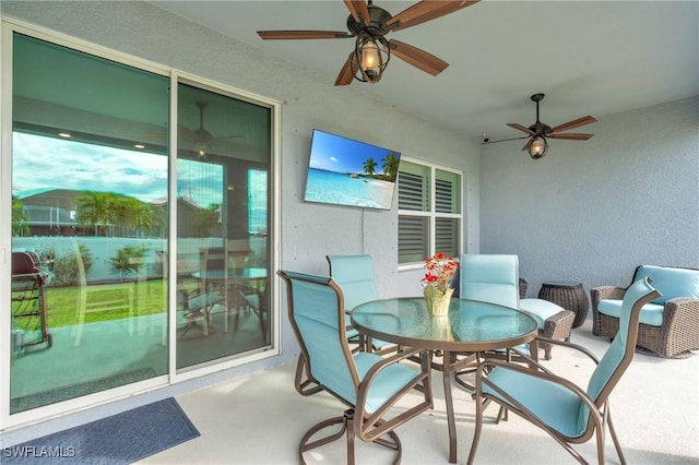 exterior space featuring ceiling fan