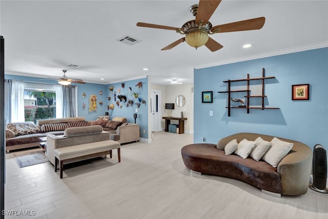 living room featuring ornamental molding and light hardwood / wood-style floors