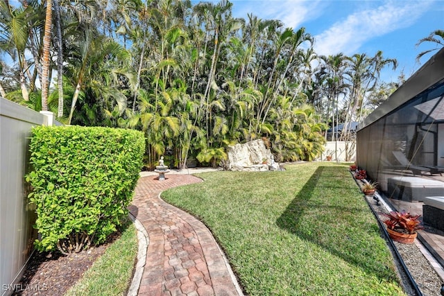 view of yard featuring a lanai