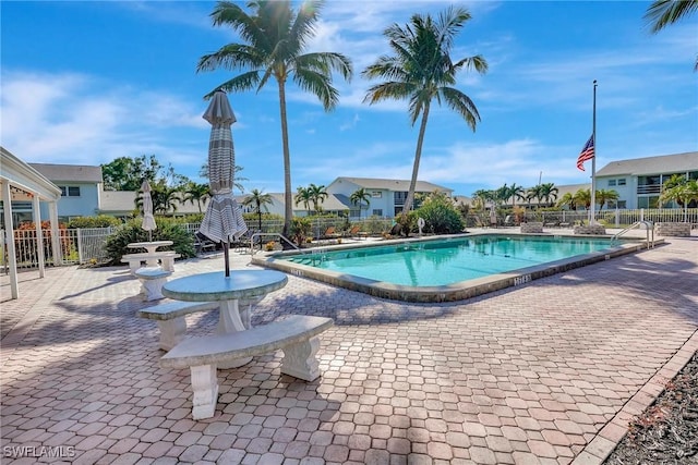 view of swimming pool featuring a patio area