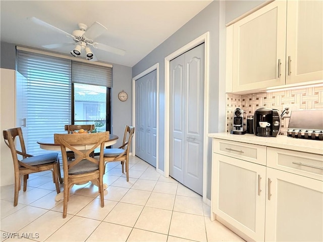 dining room featuring ceiling fan and light tile patterned flooring