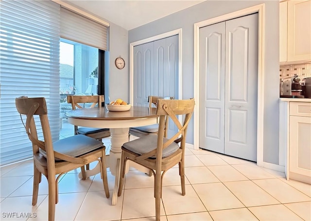 dining room with light tile patterned flooring