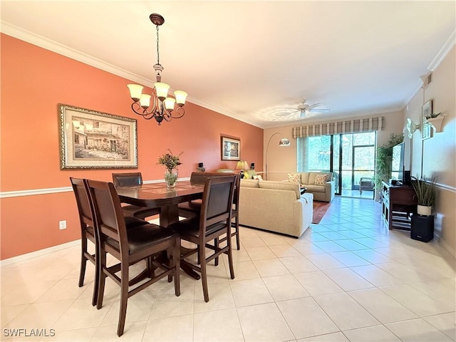 dining space featuring ceiling fan with notable chandelier, light tile patterned floors, and ornamental molding