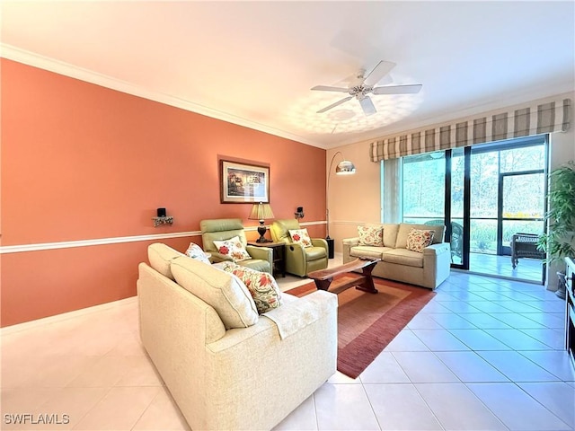 living room with ceiling fan, light tile patterned floors, and crown molding