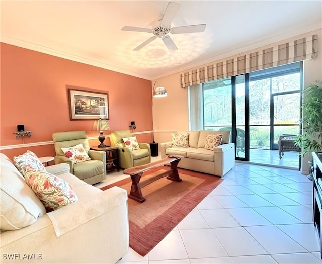 tiled living room with ceiling fan and ornamental molding