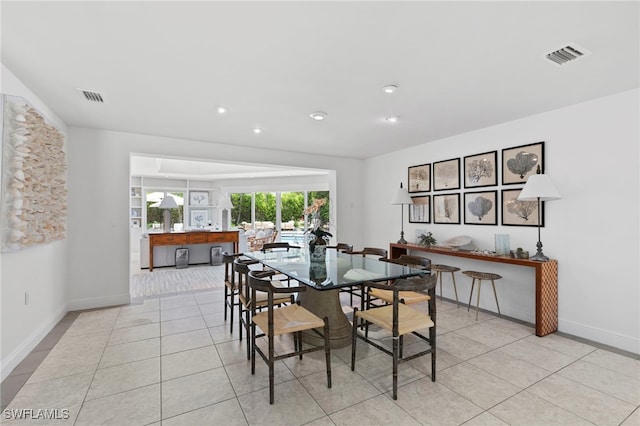 dining space featuring light tile patterned floors