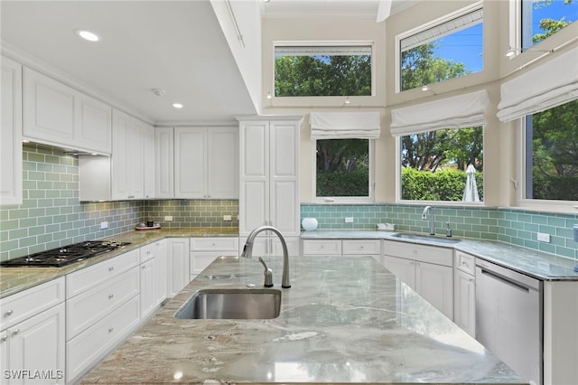 kitchen featuring sink, white cabinets, and appliances with stainless steel finishes