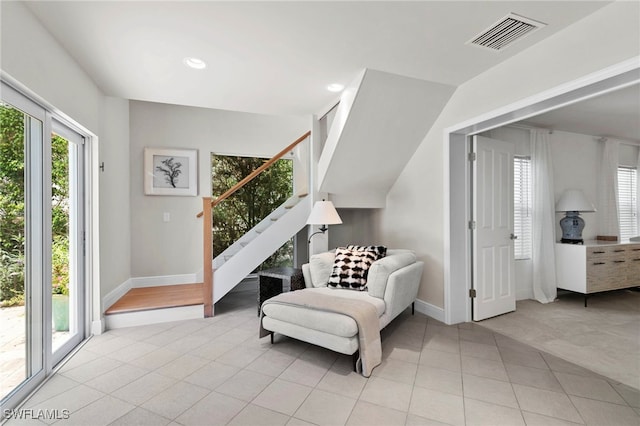 living area featuring light tile patterned floors