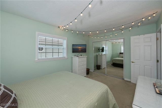 carpeted bedroom with a closet