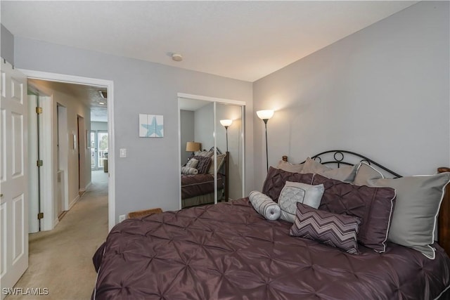 carpeted bedroom with a closet