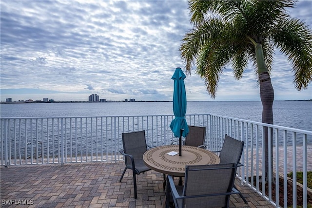 view of patio with a water view