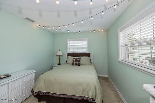 bedroom featuring light colored carpet