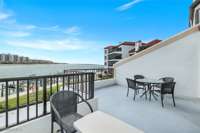 balcony featuring a water view